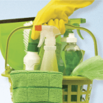 Green bucket with eco-friendly cleaning products used by our cleaners.