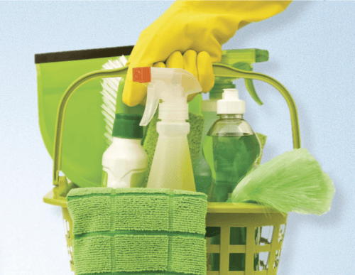 Green bucket with eco-friendly cleaning products used by our cleaners.