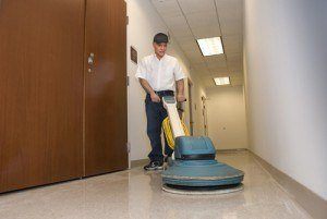 Floor cleaning equipment in use with advanced techniques by a SanMar technician. Office cleaning services NYC
