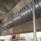 Image of a clean kitchen hood. Exhaust hood cleaning services are a crucial part of fire prevention for restaurants in NYC.