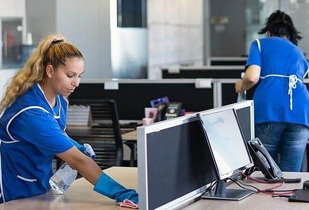SanMar professional janitors cleaning an office in NYC, office cleaning NYC.
