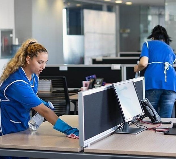 SanMar professional janitors cleaning an office in NYC, office cleaning NYC.
