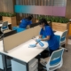 New York City janitors wiping down workstations in an commercial office building.