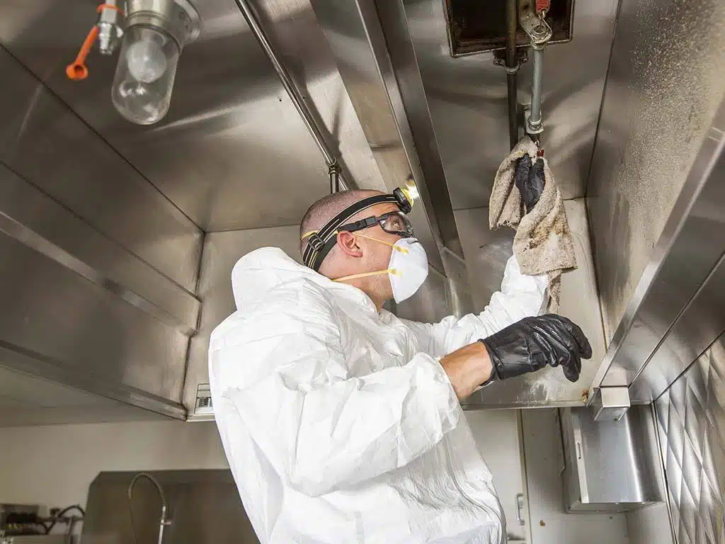 New York City exhaust hood and vent cleaning services being performed by a professional.