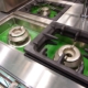 Clean kitchen burners at a restaurant.