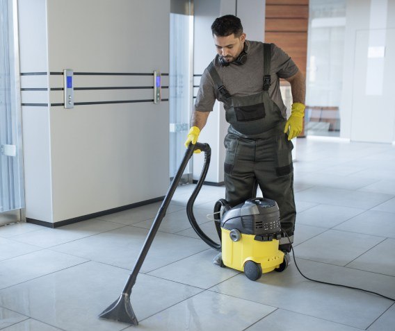 NYC commercial cleaner using floor cleaning equipment to clean commercial buildings.