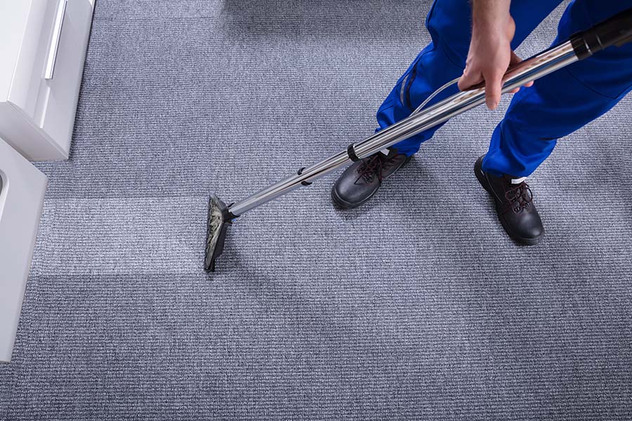 Office carpet cleaner removing stains from a carpet.