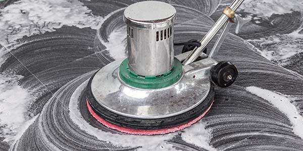Buffing machine polishing marble floors, New York City.